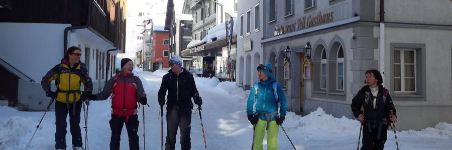 Skiers enjoying Andermatt's picturesque town centre